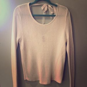 White, slouchy, open back sweater.